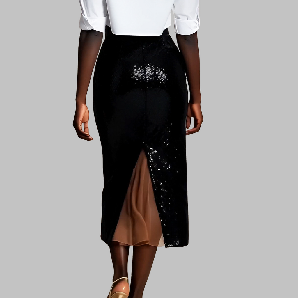 Black sequin skirt with a white top on a gray background