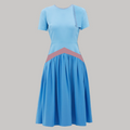 Blue dress with a pink band on a white background