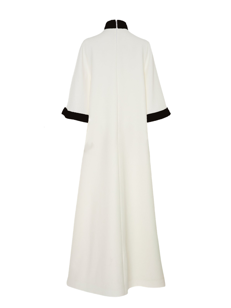 White dress with black trim on a white background