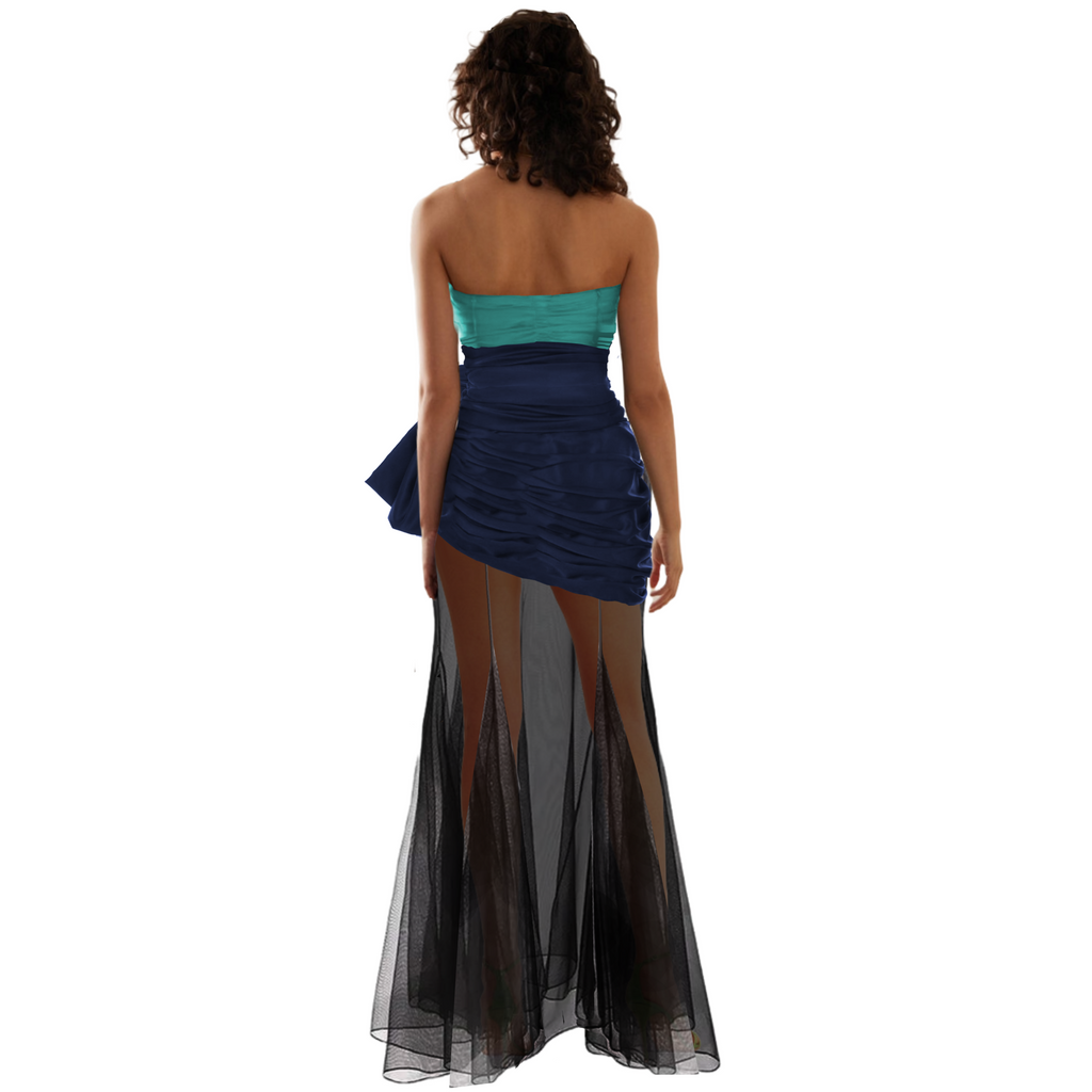 Woman wearing a strapless dress with a two-tone design on a white background