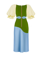 Green and blue dress with cream sleeves on a white background