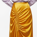 Yellow satin skirt with a white background