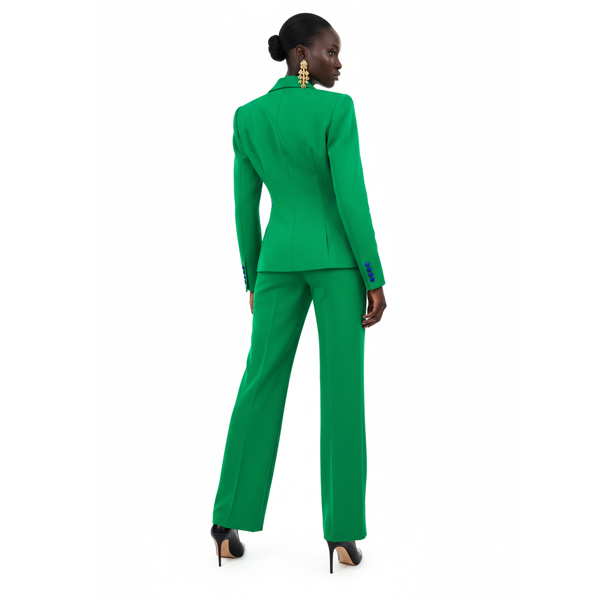 Person wearing a green suit on a white background