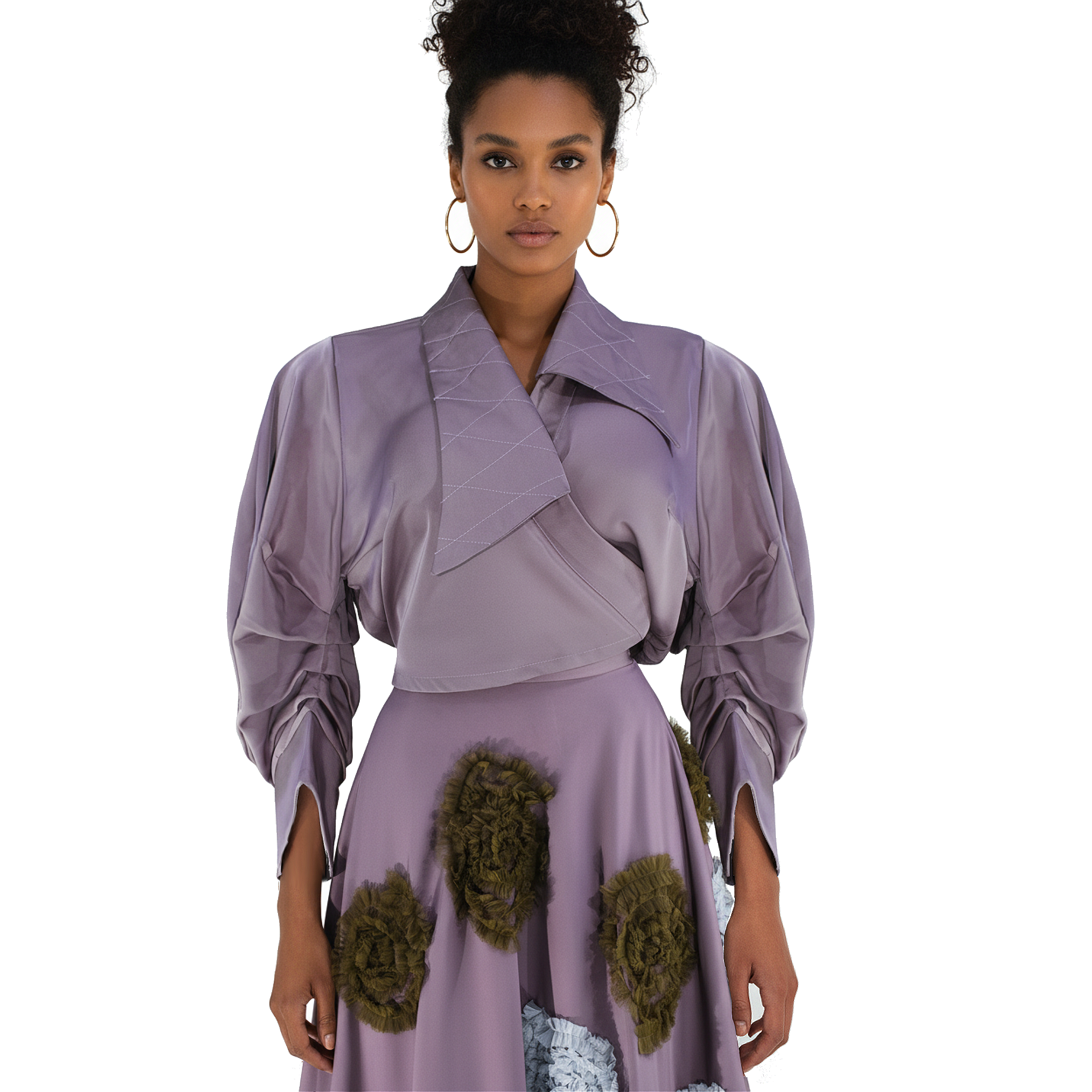 Woman wearing a purple outfit with floral details on a white background