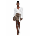 Woman wearing a white wrap top and brown skirt on a white background