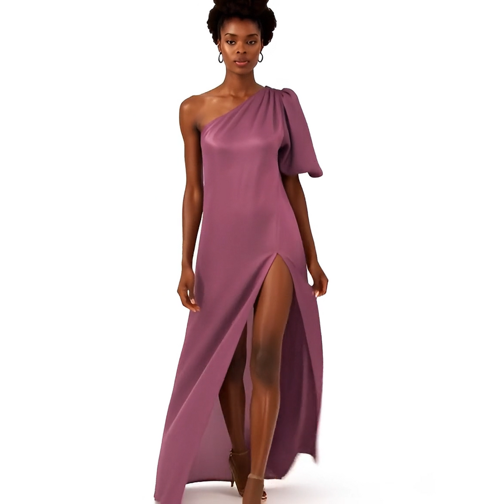 Woman wearing a one-shoulder purple gown on a white background