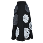 Black skirt with white and gray circular patterns on a white background