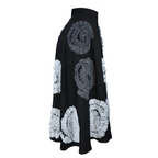 Black skirt with white and gray circular patterns on a white background