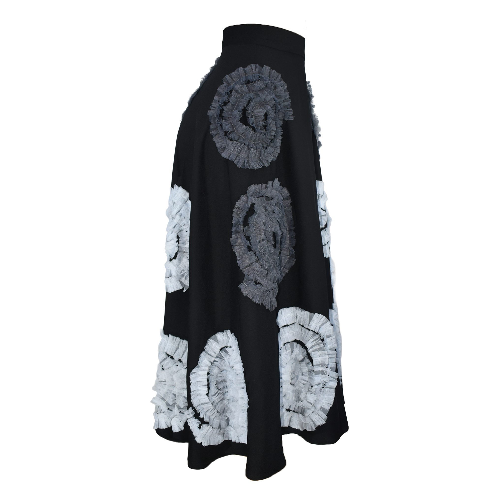 Black skirt with white and gray circular patterns on a white background