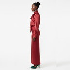 Woman wearing a red outfit with a white background