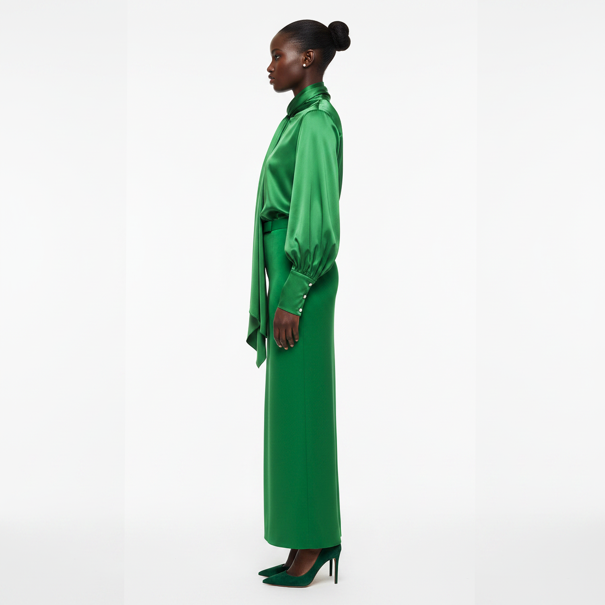 Woman wearing a green dress on a white background