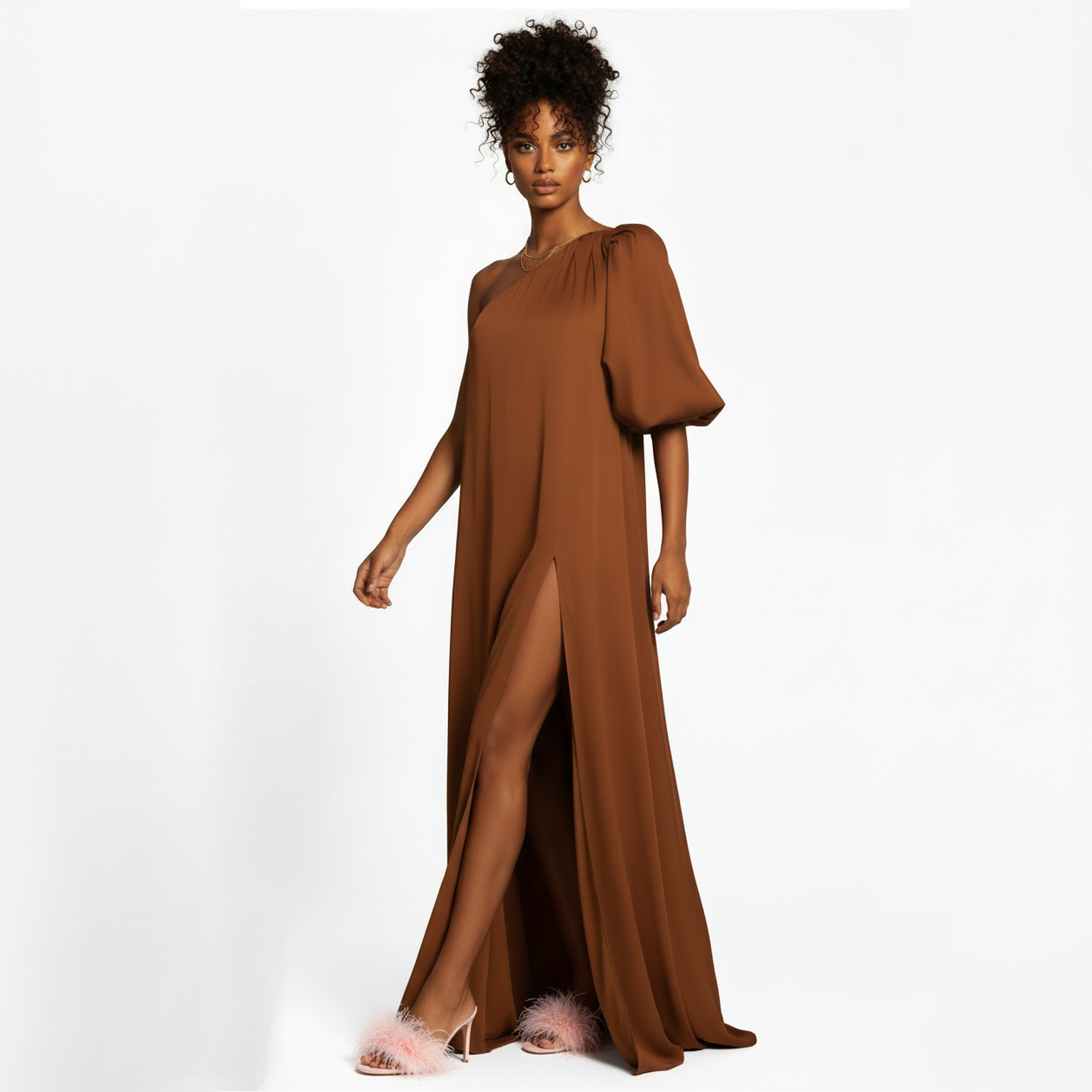 Woman wearing a brown dress with puff sleeves on a white background