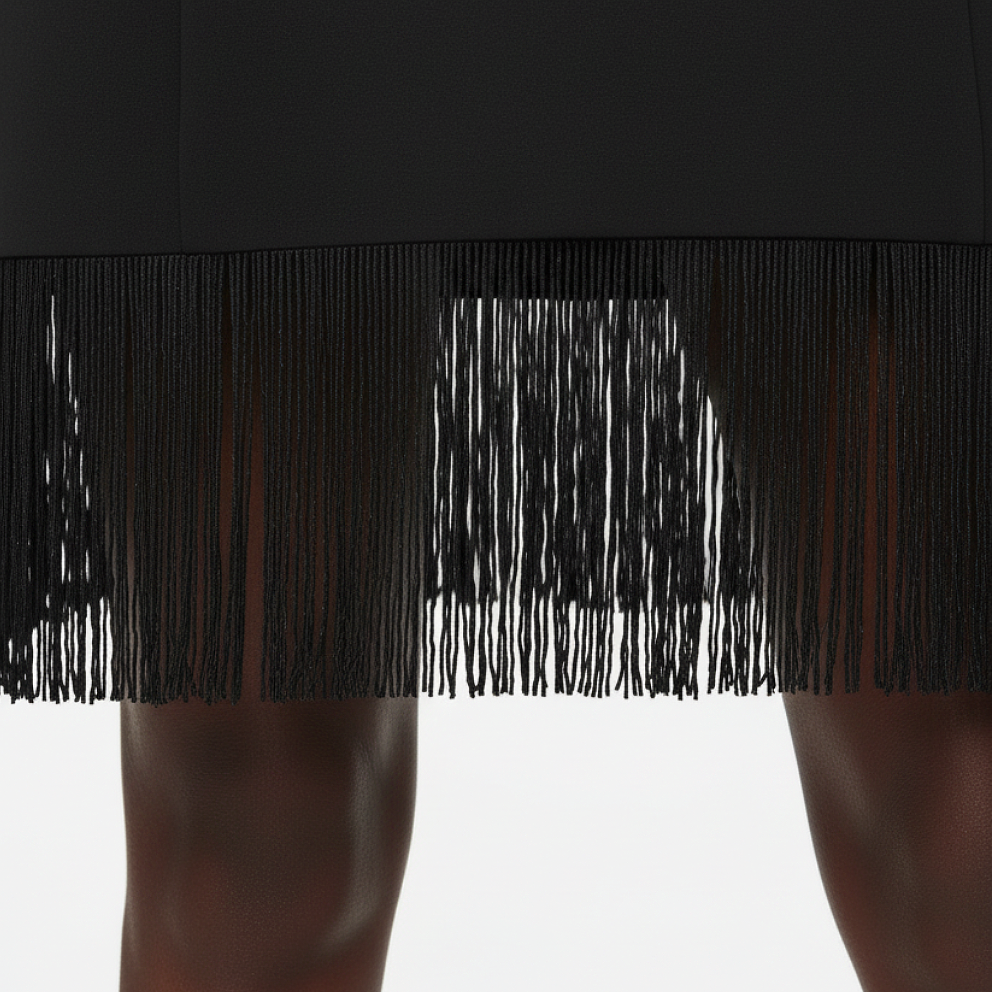 Close-up of black fringe on a garment against a white background