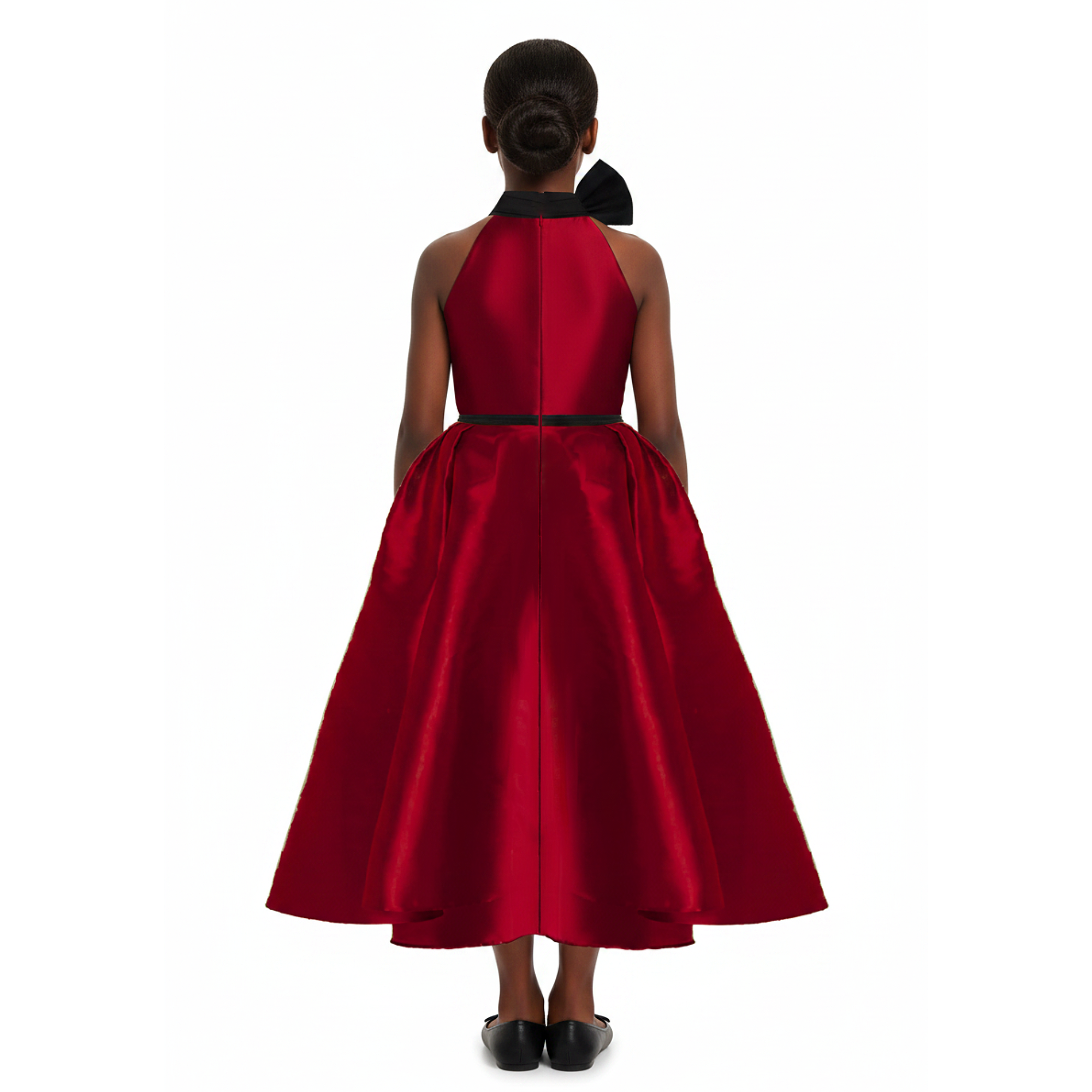 A girl wearing a wine red dress with black bow on a white background