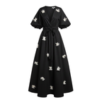 Black dress with white floral embellishments on a white background