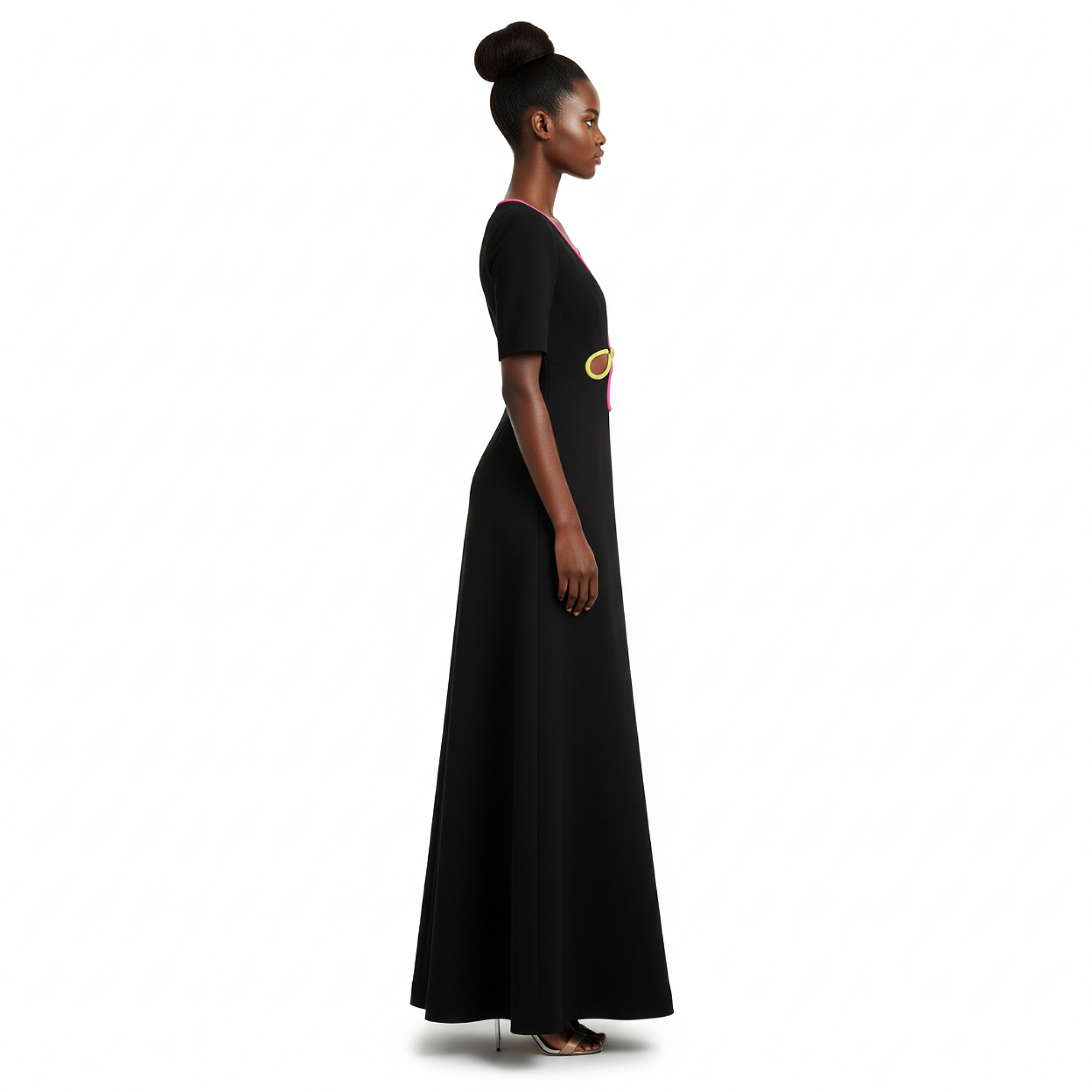Woman wearing a black dress with a yellow belt on a white background