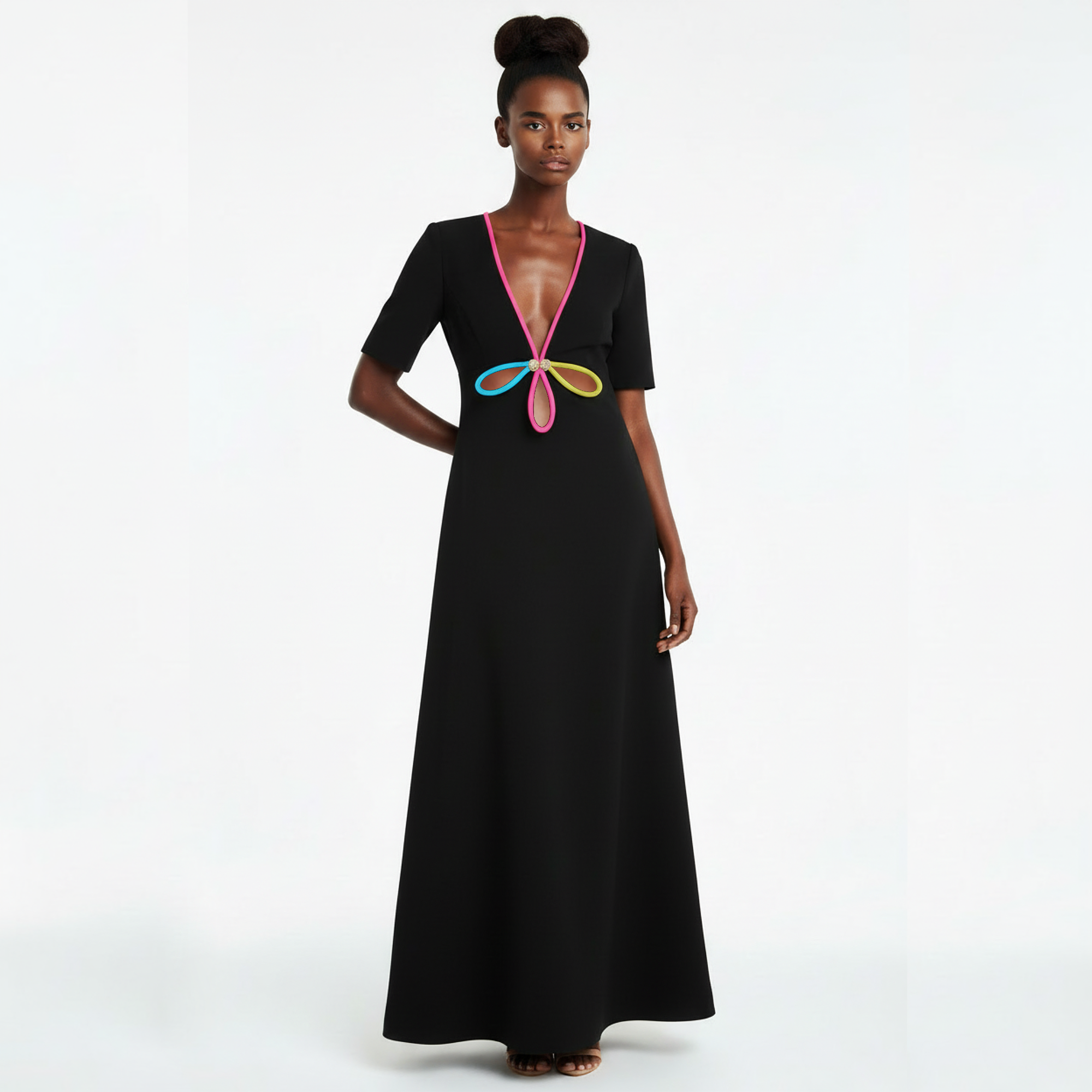 Black dress with colorful butterfly design on a white background