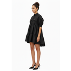 Woman wearing a black dress on a white background