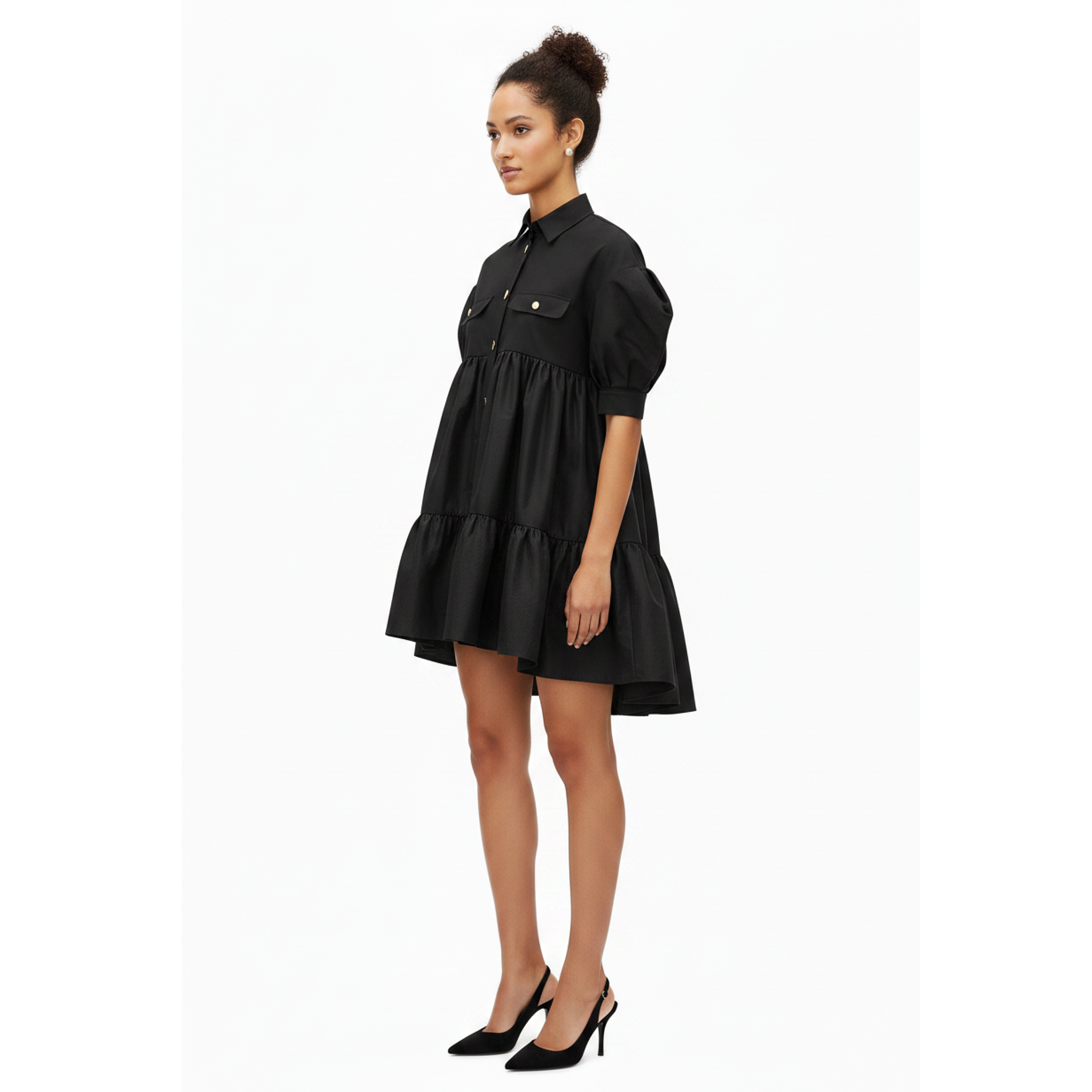 Woman wearing a black dress on a white background