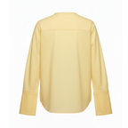 Yellow blouse on a white background