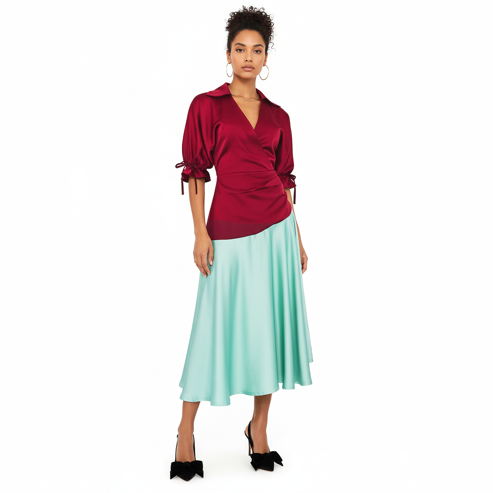 Woman wearing a dress with a red blouse and light blue skirt on a white background