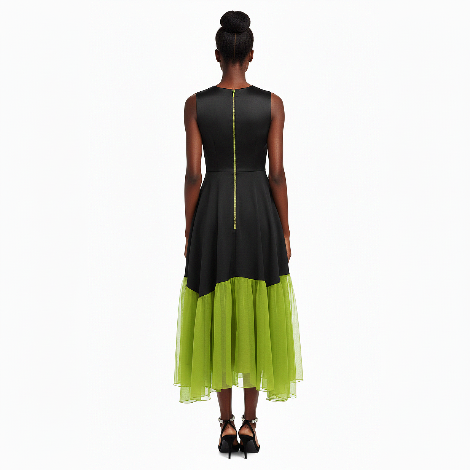 Woman wearing a black and green dress on a white background