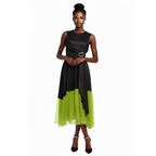 Woman wearing a black and green dress on a white background