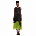 Woman wearing a black and green dress on a white background