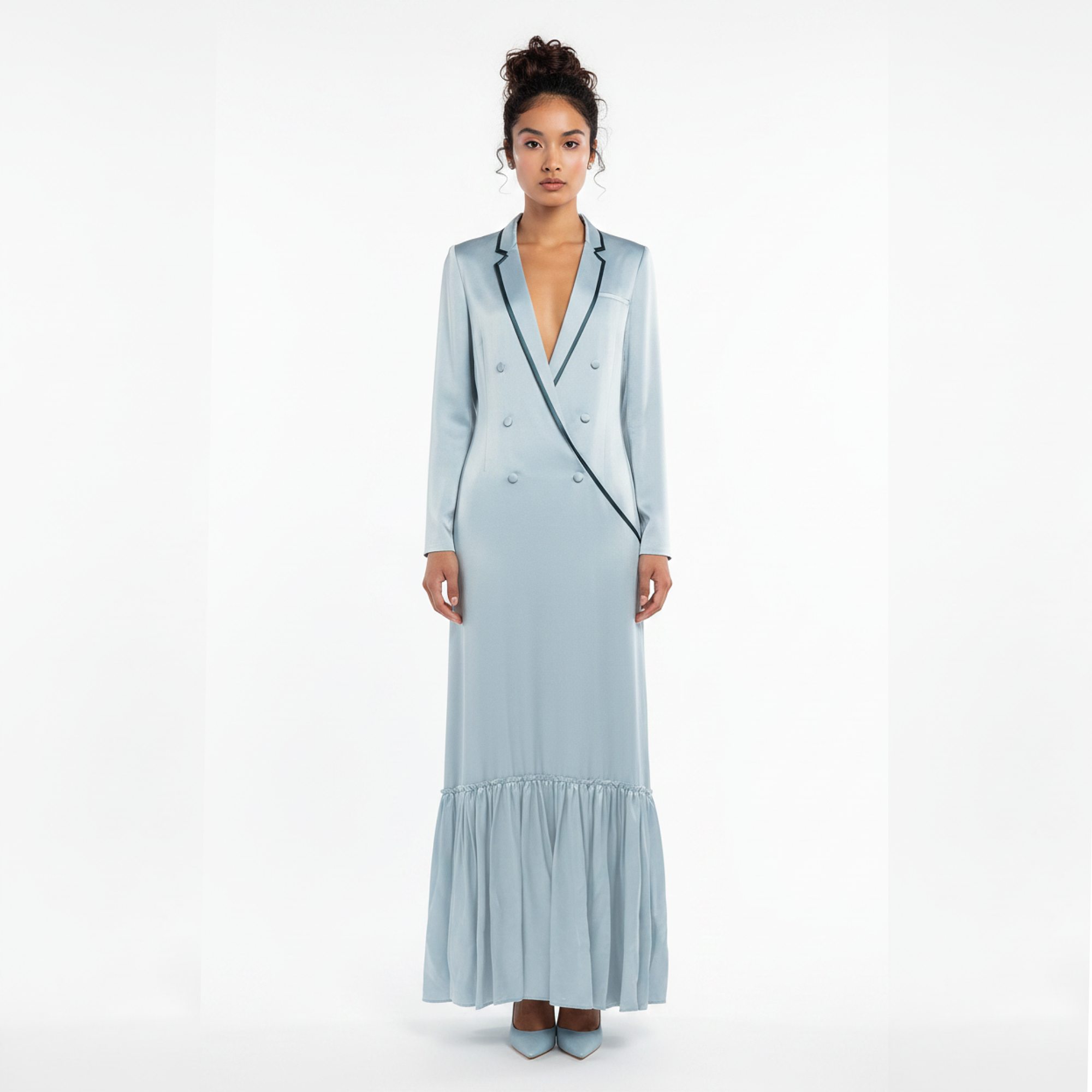 Woman wearing a light blue dress with black trim on a white background