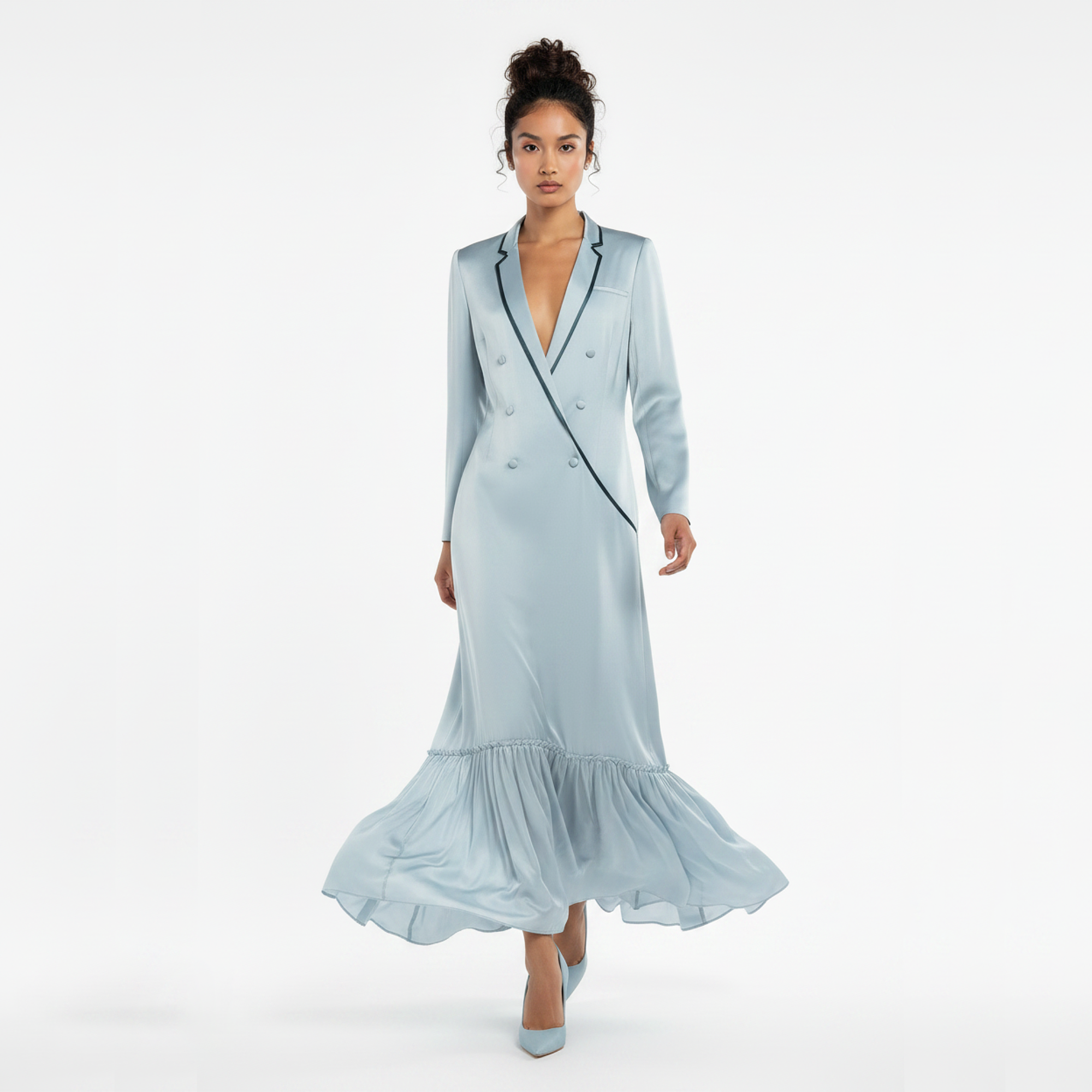 Woman wearing a light blue dress with a white background