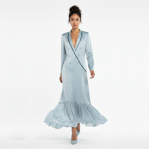 Woman wearing a light blue dress with a white background