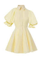 Model wearing a Maison Aria Dress