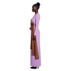 Woman wearing a long, light purple dress with a brown belt on a white background