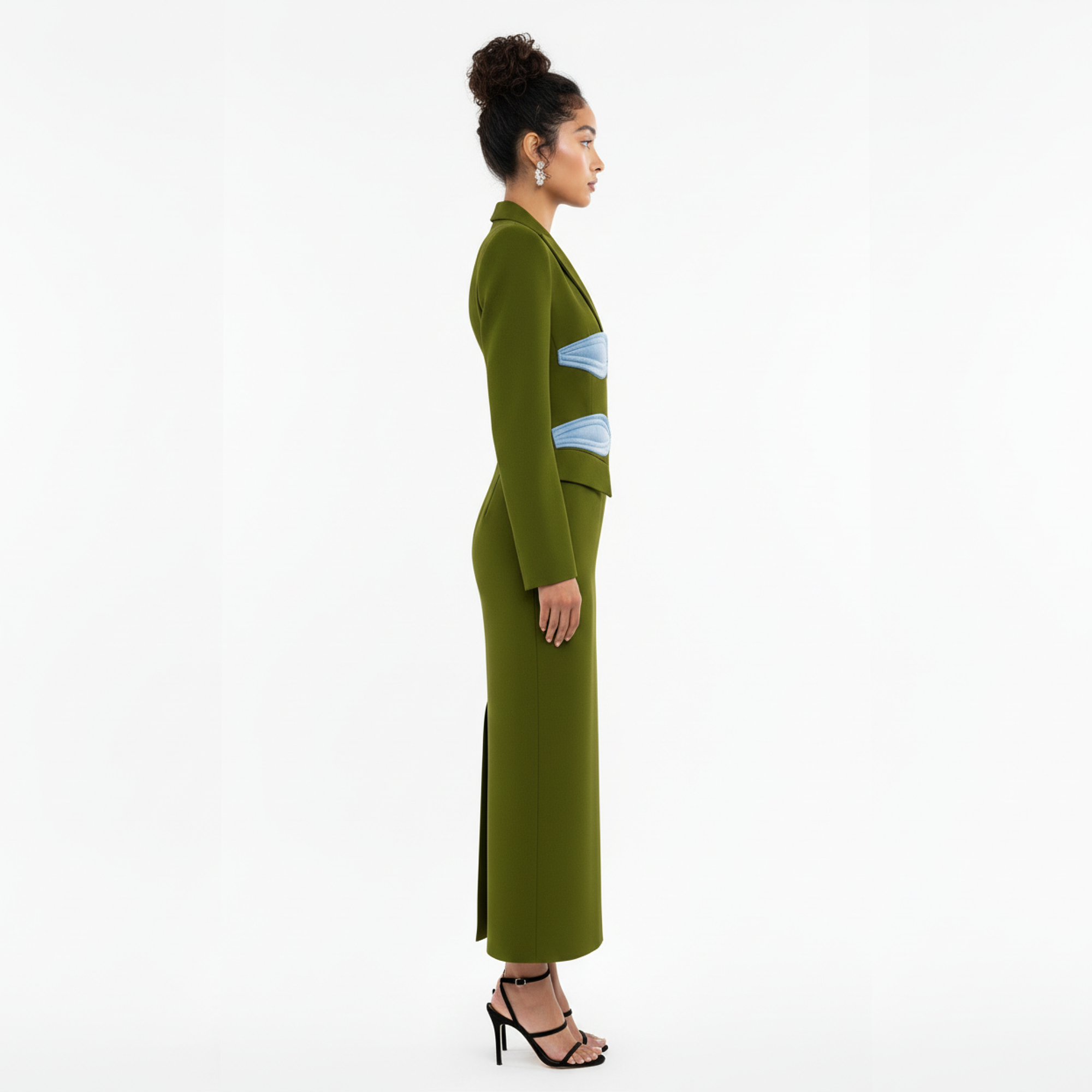 Woman wearing a green outfit with a white background