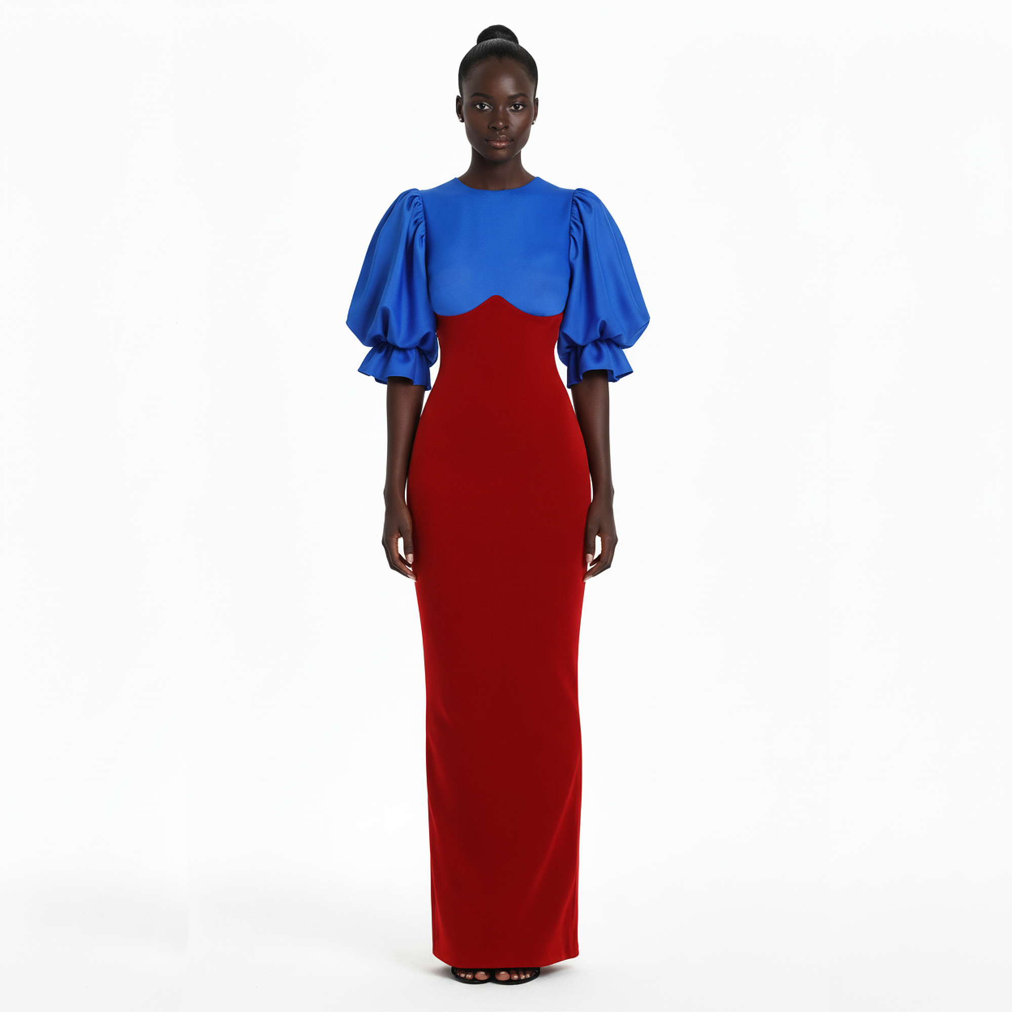 Woman wearing a blue and red dress on a white background