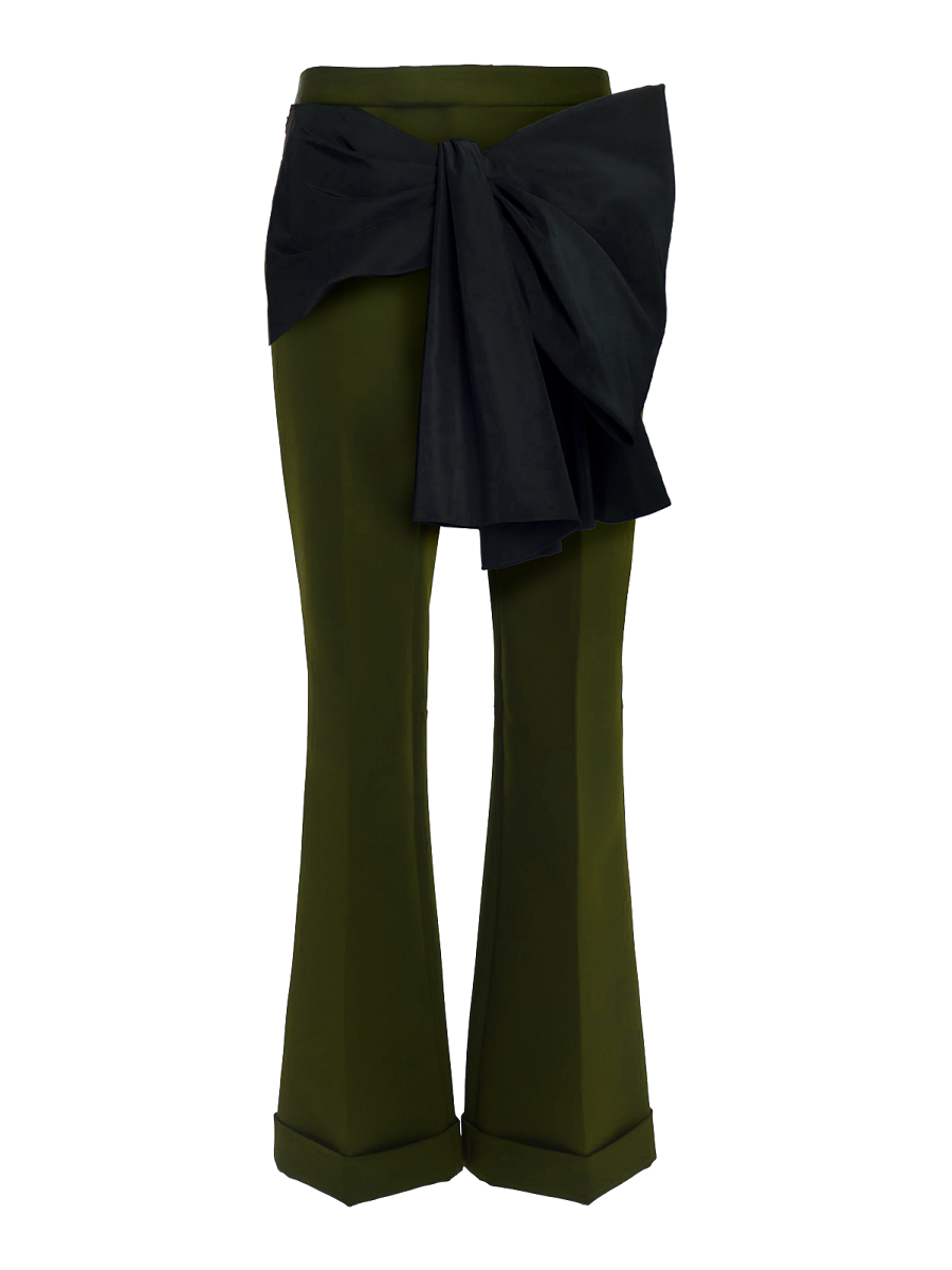 Green pants with a large black bow on a white background
