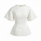 White peplum top on a white background